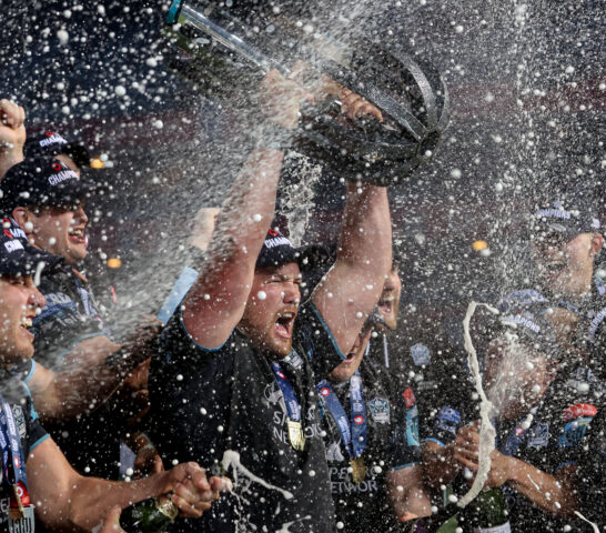 Zander Fagerson lifts the trophy in celebration 22/6/2024
