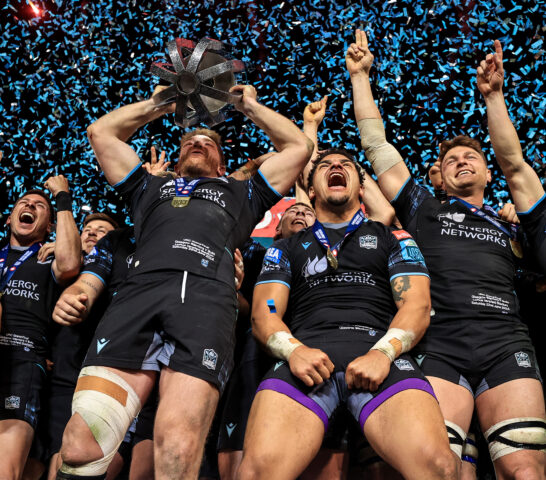 Huw Jones, Seb Cancelliere, Kyle Steyn, Sione Tuipulotu, Jack Dempsey and George Horne celebrate during the trophy lift 22/6/2024